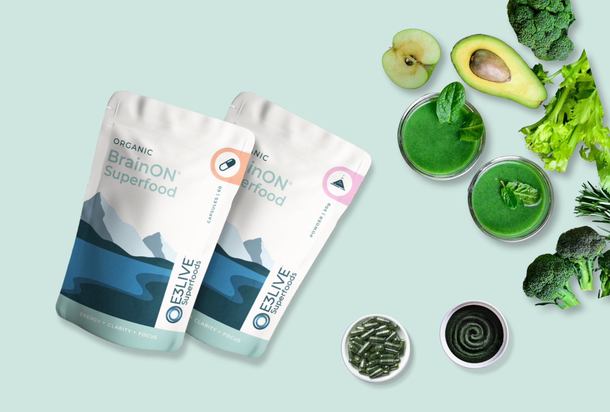 BrainON Superfood products, in powder and capsule forms, are displayed alongside fresh green ingredients like avocado, pear, broccoli, and leafy greens, with green smoothies. This image highlights BrainON's benefits for energy, mental clarity, and focus, showcasing nutrient-rich superfoods designed to support cognitive health.