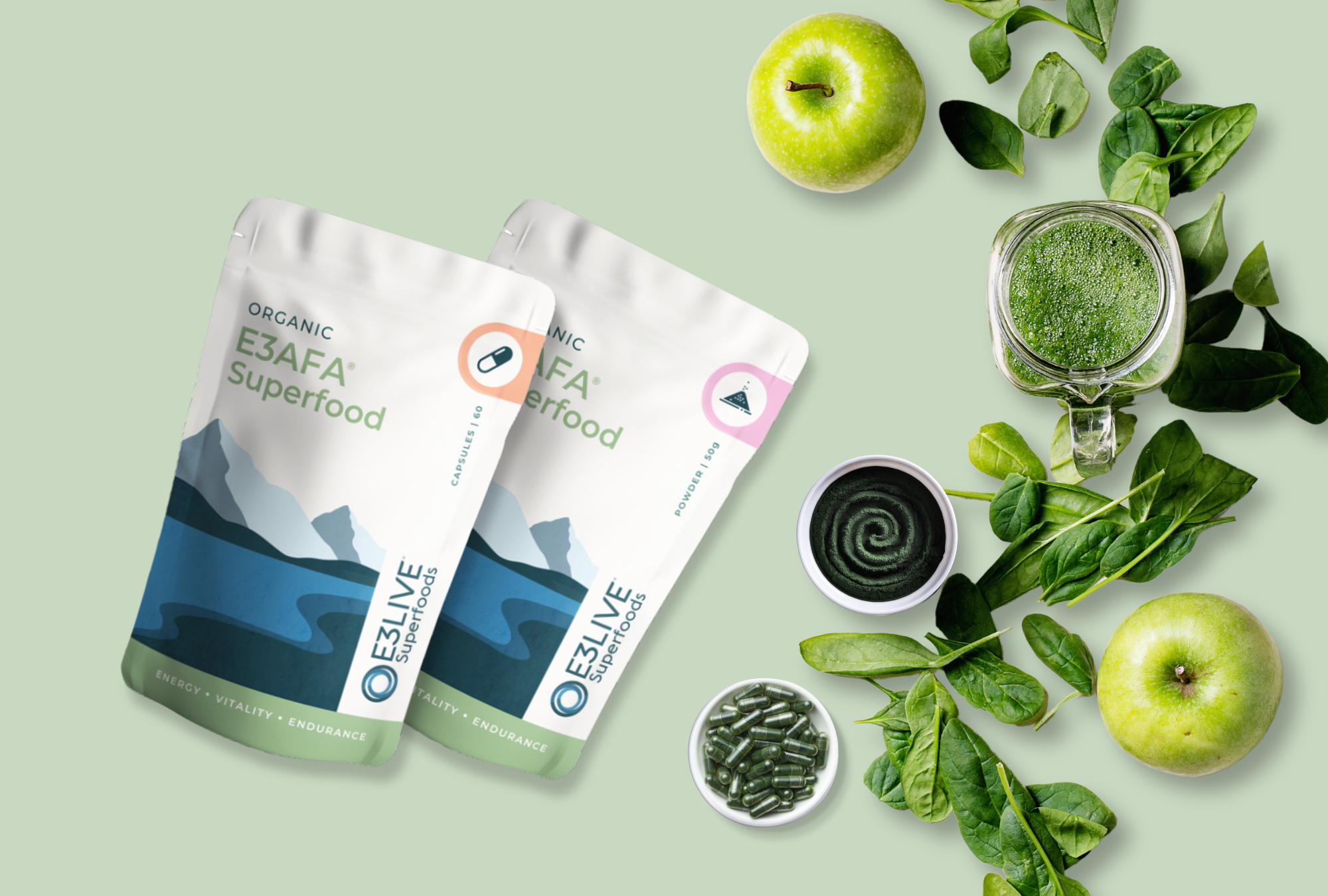 E3AFA Superfood products in powder and capsule forms, displayed with green apples, spinach, and a green smoothie, highlighting the benefits of energy, vitality, and endurance with organic superfoods for overall wellness.