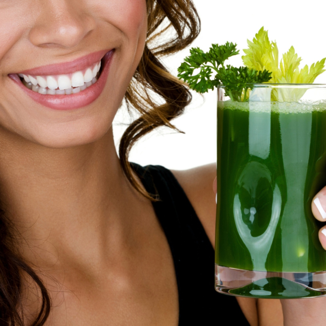 Woman drinking vegetable juice with E3AFA superfood powder